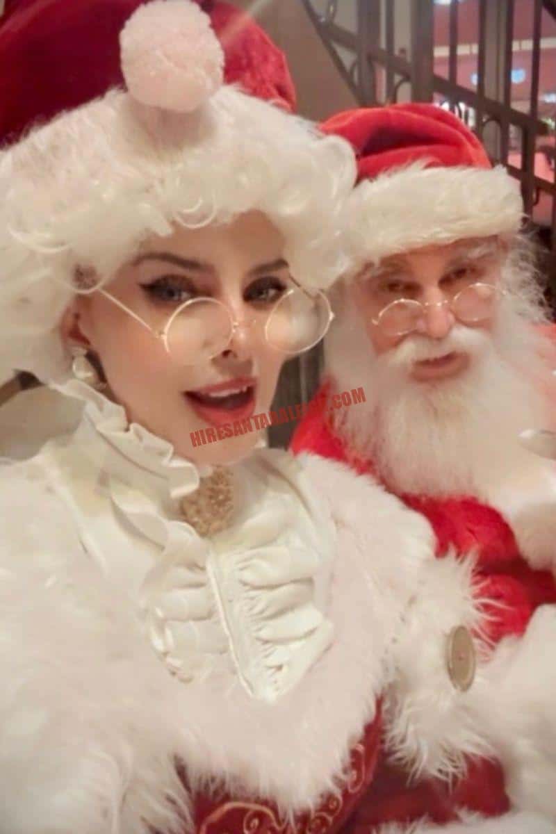 Santa and Mrs. Claus in red and white costumes for hosts who hire a Santa near you in Raleigh